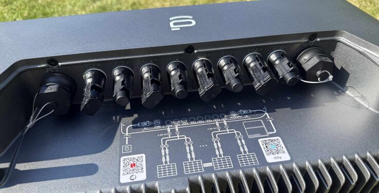 The connections for PV and the power grid are located at the top under a cover (already removed here).