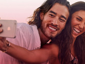 Wouldn't you be all smiles too if you only had to pay $1 for monthly mobile service? (Source: Virgin Mobile)