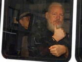 Julian Assange after being arrested by the London Metropolitan Police (Image source: Reuters)