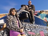 GTA 6 artwork showing two characters posing on a customized vehicle
