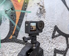 DJI Osmo Action 6 in front of a graffiti wall