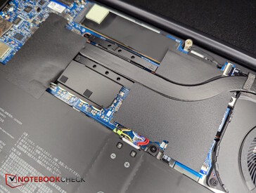 AMD version: Lots of black plastic covers, SSD positioned at the top near the display edge.