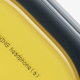Close up of Nothing Headphone (a) in yellow.