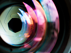 A close up stylized image of a camera lens shutter