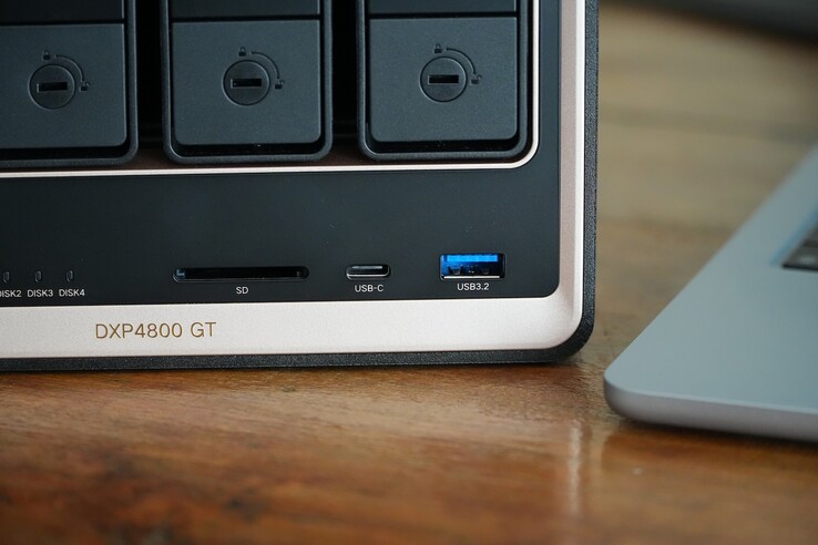 The Ugreen NASync DXP4800 GT has a black-and-gold chassis