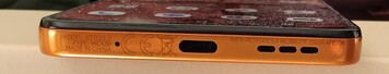 Bottom: microphone, USB-C port, speaker