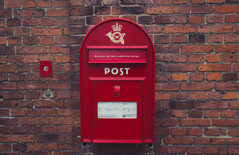 The price of digital change: PostNord employees lose their jobs. Pictured: Red letterbox in Denmark (Image source: Wikimedia Commons)