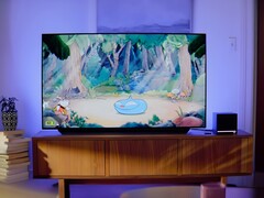 Valve Steam Machine shown in living room next to a TV (Image source: screenshot, Valve YouTube with edits)