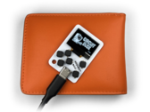 The Arduboy Mini will fit comfortably inside a wallet. (Image source: Kevin Bates)