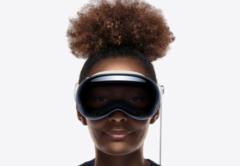She&#039;s smiling, but not because she is watching immersive 3D porn. (Image: Apple)