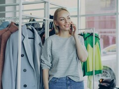 Decorative image. A person standing in a clothing store