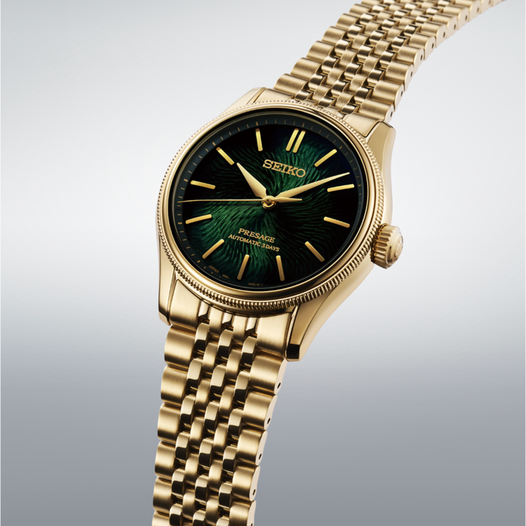 Close-up of the Seiko Presage Classic x Tradman’s Bonsai watch with a textured dark green dial, gold-tone hands and markers, and a gold-tone bracelet.