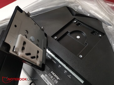 Clamp the stand into the VESA device on the monitor