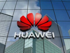 Huawei corporate logo on an office building, Huawei using backdoor to access global mobile networks February 2020 news