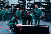 Death has never been more impersonal in Squid Game; in Season 3, even grief becomes ritual—wrapped in pink and buried under silence. (Image source: Netflix)