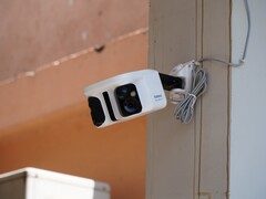 Baseus X1 Pro security camera mounted on a wall.