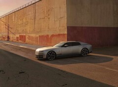 Jaguar Type 01 EV in the evening sun in front of a high wall