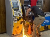 A police officer cutting into the Bitcoin ATM with a hand-held abrasive saw (Image source: Jasper County Sheriff’s Office via Facebook; cropped)