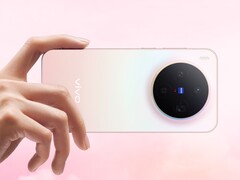 Vivo X300 smartphone in pink gradient finish showcasing the circular Zeiss-branded triple camera module (Image source: Vivo)