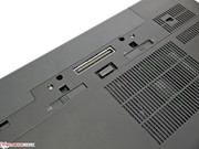 Two sliders are located below the docking port, keeping the battery and the cover in place.