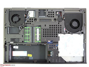 The battery and two screws have to be removed before lifting off the base plate.