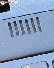 The speakers are located above the keyboard.