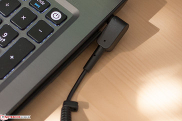The power adapter cable can limit access to the optical drive
