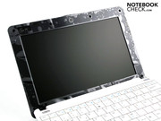 The only glossy surface on the white netbook is the screen bezel. Shown here as delivered, with a protective plastic layer.