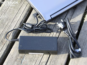 The heavy 90 watt power adapter (360 grams) supplies the laptop's