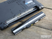 The battery can be taken out for stationary use.  Since it doesn't have rubber feet for elevating the back of the laptop, its incline is unaffected by the battery's removal.