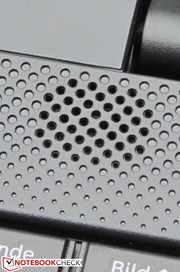 The speakers are located above the keyboard.