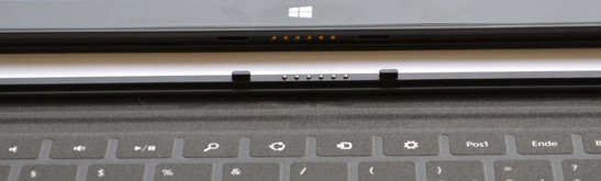 Touch Cover or Type Cover dock magnetically to the bottom of the tablet.