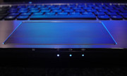 Lights on the front face of the laptop near the touchpad.