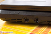 On the left side of the case, are the audio ports along with the milky blue status LEDs, ...