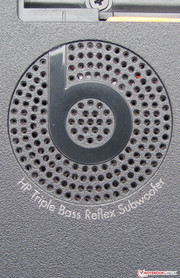 The subwoofer is placed on the bottom of the notebook.