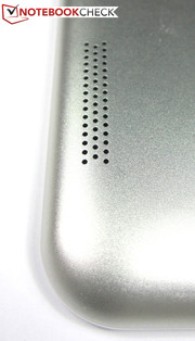 The speakers are located on the back cover's left and right edges.