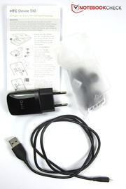 Included in the box: the modular power adapter, the Micro-USB cable, headphones, and a quick-start guide.