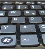 The keyboard edging is has a glossy plastic surface.