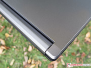 The hinge's cover has a brushed-metal finish...