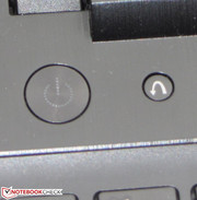 The One-Key Recovery button (right) starts the recovery system and enables accessing the BIOS.