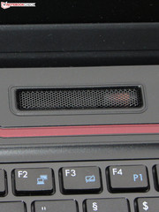 Two speakers are located above the keyboard,...