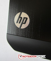 The HP logo is illuminated white when the notebook is switched on.