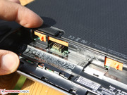 This mechanism holds the battery firmly in position. The bottom cover can easily be removed.