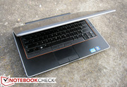 Orange lining around the keyboard is the signature look for this Dell series