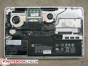 Exposing the motherboard requires removing a set of additional Philips head screws