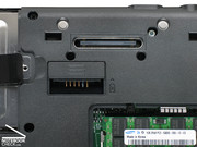 At the bottom side, there is a slot for a supplement battery and a port replicator port.