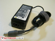 The AC adapter provides up to 65W of power at 20V