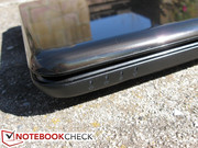 The front edge is bare, save for the four system status lights