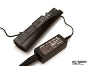 The adapter is small and is delivered in the color of the netbook