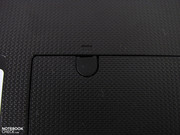 The RAM access is fixed with a screw under a rubber cover.